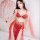 Woman wearing red lace lingerie set with gold accents, sheer robe, and decorative headpiece for elegant date night or bedroom...