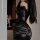 Woman in black lace one-shoulder bodycon skirt set holding wine glass, sheer secretary outfit for date night.