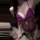 Sheer purple lace bodysuit with bow detail, open-crotch design for intimate date night wear.