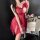 Woman in red lace butterfly knot mesh slip dress holding wine glass, perfect for seductive date night sleepwear.