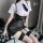 Sexy teacher role play outfit featuring a white blouse, black leather corset, mini skirt, stockings, and tie accessory.