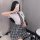 Womens seductive schoolgirl costume featuring a white blouse, plaid skirt, and tie, perfect for role play with a college them...