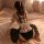 Sexy maid costume set featuring black lingerie with ruffled details and a large bow, perfect for passionate role play.