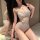 Woman wearing a sheer, tight-fit lace bodysuit with intricate floral patterns and cut-out details, designed as erotic lingeri...