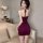 Woman modeling burgundy backless halter crop top and ultra-slim pencil skirt set, featuring lace bralette with metal rings.