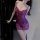 Woman wearing purple lace sleepwear set with sheer panels and bow details, perfect for intimate nights or role play.