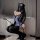 Woman in sexy police uniform costume with blue bodysuit, black lace gloves, thigh-high stockings, and cap, posing seductively...