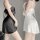 Two women modeling black and white ruffled cami lingerie sets with adjustable straps, showcasing the sheer chiffon fabric.
