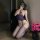 Woman kneeling in purple lace mesh bodystocking with floral embroidery, sheer full-body net stocking, seductive and stretchy ...