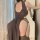 Woman wearing a high-waist split cheongsam lingerie set, showcasing its reversible design and seductive style for bedroom rom...