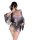 A woman poses in a purple wuli tu temptation lingerie set, featuring a deep v neckline and floral fox dream design, styled li...