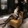 Woman in wuyan diao sensual secretary-style lingerie set, featuring white blouse and black skirt, seated elegantly in a cozy ...