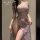 Woman wearing lavender lace wuyan diao qipao lingerie with open-crotch design, sheer fabric, and elegant off-shoulder cut for...