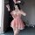 A woman poses wearing a festive bunny-themed red velvet costume, complete with bunny ears, gloves, and stockings, perfect for...
