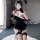 Seductive black lace cheongsam lingerie set with fishnet top and stockings, perfect for nightwear or party outfits.