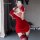 A woman poses in a red lace cheongsam lingerie set, featuring a festive design with gloves and stockings, perfect for a night...