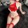 A woman models a festive red silk bodysuit with white trim, featuring a halter neck design and fishnet stockings, perfect for...