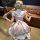 Elegant maid costume cosplay outfit featuring a charming pink and white checkered dress with ruffled sleeves and a bow at the...