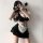Sexy maid costume for women featuring a black and white outfit with lace details, perfect for cosplay or evening wear.