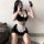 Sexy maid costume for women featuring a black and white outfit with lace details, perfect for cosplay or evening wear.