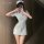 Woman in light blue xianyi sexy nurse costume with heart detail, short dress and cap, posing for mirror selfie.