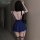 Back view of woman in xianyi navy blue lingerie set with garter straps, open-back design, and flared skirt for nightclub wear...