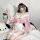 A woman poses wearing a cute pink bunny-themed japanese-inspired kimono-style lingerie set, complete with bunny ears and lace...