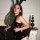 Woman wearing xiyun bunny costume lingerie set – sexy sheer bodysuit with bunny ears, posing by ornate mirror and black decor...