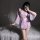 A woman poses in a japanese kimono-inspired lace sleepwear set, featuring sheer details and floral patterns, perfect for a se...