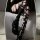 Edgy black thigh-high socks with ripped design and lace-up leg warmers for bold fashion statements.