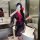 A woman poses in a bathroom wearing a sheer black hanfu-inspired robe with red accents, featuring floral patterns and a no-re...