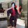 A woman poses with a smartphone, wearing a sheer hanfu-inspired erotic robe in black with red accents. she holds a red and bl...