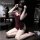 Woman kneeling in yaqin nu lingerie set, wearing seductive low-cut burgundy sleep dress with high slit and matching lounge se...