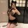 Woman wearing black lace yaqin sexy lingerie set with cat ears, featuring bodycon secretary skirt and plus size no-remove int...