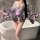 A woman poses in a luxurious yasise night fantasy lingerie set, featuring a deep v neckline and elegant kimono-style design w...