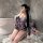 A person wearing a yasise sexy deep v anime kimono lingerie set poses for a mirror selfie, featuring a floral design and eleg...