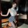 A woman poses elegantly wearing a stylish new year lingerie set, featuring a lace-trimmed bodice, bodycon slip dress, and str...