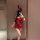 A woman poses in a red halter bunny costume, featuring a sparkly bodysuit with a bow headband, perfect for cosplay or live st...