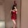 A woman poses in a red halter bunny costume with sparkly sequins, perfect for cosplay or live streaming events.