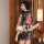 A woman stands elegantly wearing a yefeiyi japanese kimono-style sleepwear set, featuring a floral pattern and flowing sleeve...