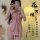 A mirror selfie captures a person wearing a pink floral halter dress, paired with a matching tie-front top. the ensemble feat...
