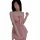 A woman models a pink yegesu star plus size lingerie set, featuring a halter top with a bow detail and flowing skirt, perfect...