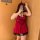 A woman poses with a smartphone, wearing a red yelanqu plus size sexy lingerie set. the outfit features lace details and a co...