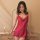 A woman poses elegantly in a vibrant red yeqiao mei sensual silk-look sleep dress featuring shoulder straps and a backless sl...