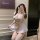 Woman in yeqin sensual lingerie set – white maid costume with apron, thigh-highs, and headpiece for intimate moments.