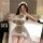 Woman in yeqin sensual lingerie set – white maid costume with bear apron, posing on bed for intimate moments.