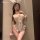 Woman wearing yeqin sexy bunny costume – sheer lace bodysuit with bunny ears, bow choker, and seductive open-crotch design.