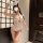 Woman wearing yeqin sexy bunny costume – sheer lace tight-fit lingerie with open-crotch design, pure & tempting outfit.