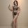 Woman modeling yeqingge black lace bodysuit set with sheer mesh crop top and high-waisted briefs, elegant floral jacquard des...