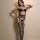 Woman modeling yeqingge sexy lace open-crotch bodystocking with sheer mesh stockings, alluring intimate wear for women.